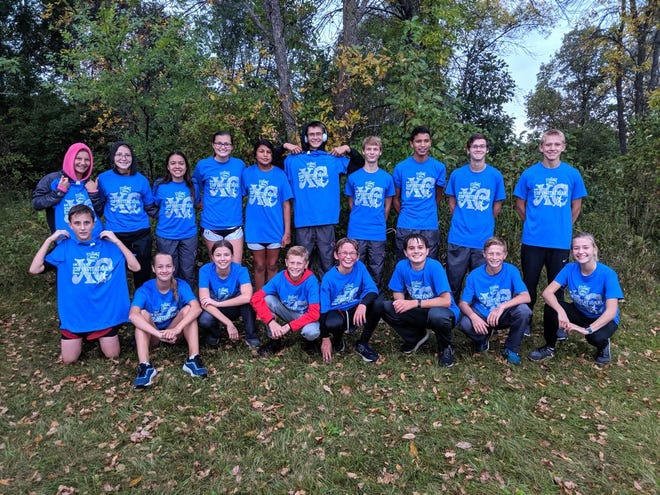 Devils Lake Cross Country teams are seen posing with shirts received from the RM Stoudt Invitational Thursday, Sept. 26, 2019 in Jamestown. The boys won the team competion scoring 31 points, beating second place Valley City by 75 points. The girls finished third.