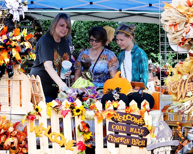 Pam Woodard, from left, Alicia Hammonds and Peggy Hammonds get in some shopping Saturday, Sept. 28, 2019, at the River Valley Artisan's Market in Pendergraft Park during the second annual Fort Smith Fall Festival downtown. [JAMIE MITCHELL/TIMES RECORD]