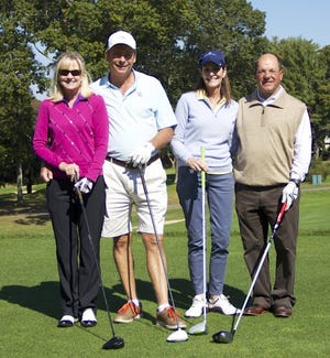 South Shore Habitat for Humanity is now accepting registrations and sponsorships for their 20th annual Charity Golf Tournament to be held Oct. 7 at the Marshfield Country Club. Pictured are golfers Doreen and Bob Parker and Louise and Rob Marchionne, who chipped in to raise funds for South Shore Habitat for Humanity. [Courtesy Photo]