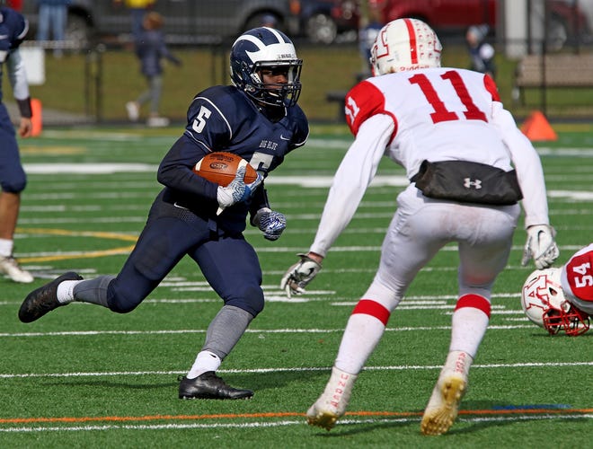 Swampscott's Zack Palmer, shown trying to get to the outside past Amesbuy's Kyle Donovan during a playoff game last year, was last Saturday's star of the game after his touchdown reception ended up being the game-winning points against host Beverly. [Wicked Local File Photo / Kirk R. Williamson]