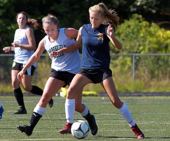Hanover sophomore Ava Toner is closely marked by Marshfield senior Sarah Kelley during their scrimmage at Cohasset High on Thursday, Aug. 29, 2019. [Wicked Local Staff Photo/ Robin Chan]
