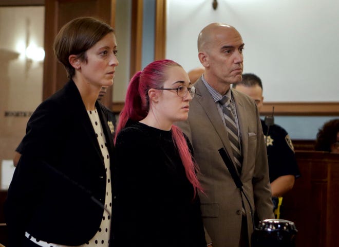 Natashza Charon, center, with her attorneys Amanda Valentino and Collin Geiselman, at her sentencing in Superior Court on Tuesday afternoon for the 2017 stabbing death of Jaheim Carter, 15. [The Providence Journal / Kris Craig]