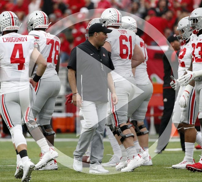 In this file photo Ohio State Buckeyes head coach Ryan Day walks through presage warmups before a NCAA Division I football game between the Nebraska Cornhuskers and the Ohio State Buckeyes on Saturday, September 28, 2019 at Memorial Stadium in Lincoln, Nebraska.
