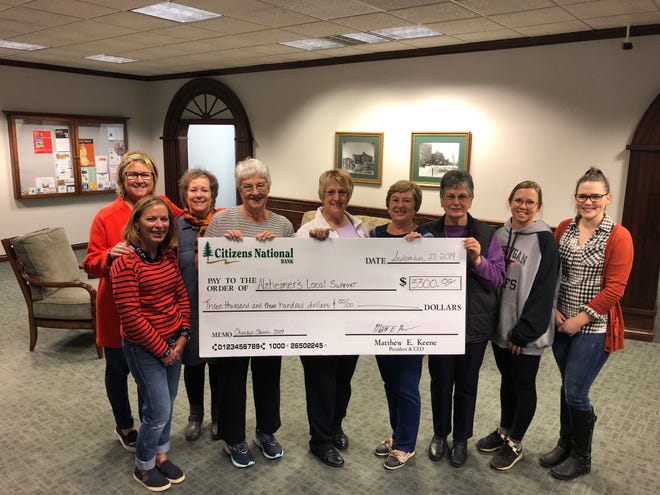 The Churchill Classic Trail Run Committee presents a check for $3,300 to the Alzheimer's Local Support Group. Pictured (from left) are CNB employees Gretchen McClymont, Nancy Lindsay and Becky Tomaski, Alzheimer's Support Group Valerie Bloom, Jean Lang, Betty Garthus and Marie Tyda, CNB employees Alishia Sanford and Kristin Stempky. Not pictured is Churchill Classic committee member Sue Cleary. Contributed photo