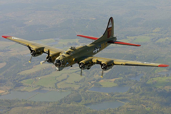 FILE - In this April 2, 2002, file photo, the Nine-O-Nine, a Collings Foundation B-17 Flying Fortress, flies over Thomasville, Ala., during its journey from Decatur, Ala., to Mobile, Ala. A B-17 vintage World War II-era bomber plane crashed Wednesday, Oct. 2, 2019, just outside New England's second-busiest airport, and a fire-and-rescue operation was underway, official said. Airport officials said the plane was associated with the Collings Foundation, an educational group that brought its "Wings of Freedom" vintage aircraft display to Bradley International Airport this week. (John David Mercer/Press-Register via AP, File)