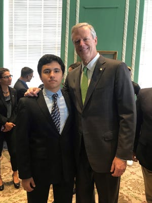 Abraham Bravo stands with Massachusetts Gov. Charlie Baker after being sworn in as the new student trustee for Mount Wachusett Community College. [SUBMITTED PHOTO]