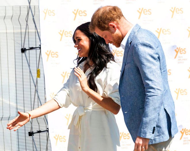 Britain's Prince Harry and Meghan, Duchess of Sussex visit a Youth Employment Services Hub in Makhulong, Tembisa, a township near Johannesburg, South Africa, Wednesday Oct. 2, 2019. The royal couple are on the last of their 10 day Africa tour. (AP Photo/Christiaan Kotze)