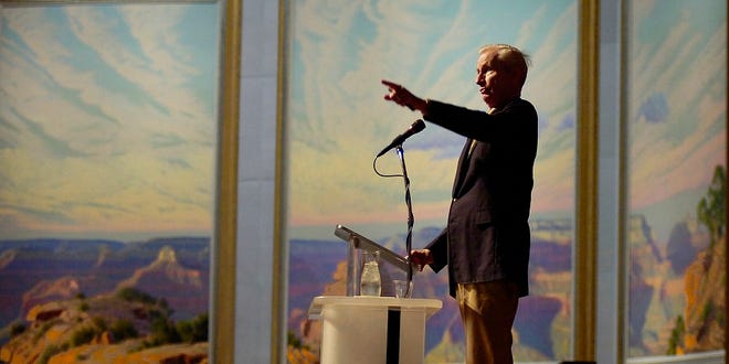 Acclaimed entertainer and Tulsa native Wilson Hurley speaks at the National Cowboy & Western Heritage Museum Friday, Oct. 7, 2005, in Oklahoma City, Okla. In the background is his monumental triptych painting