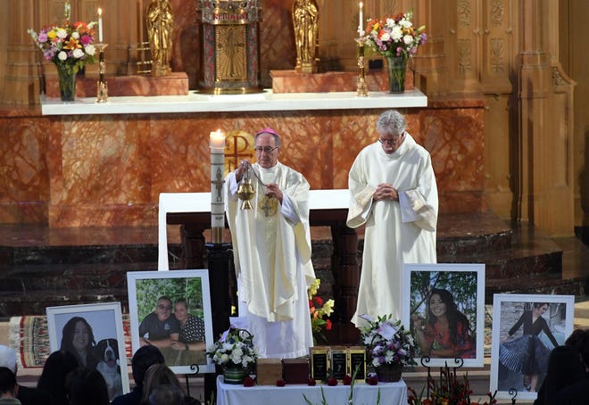 Bishop Myron J. Cotta, left, presides over a Mass of Christian Burial at Cathedral of the Annunication for the five members of the Quitasol family who perished in the Conception boat fire last month. Hundreds gathered Thursday to honor the five, a family dedicated to serving others who impacted a huge swath of the community. [CALIXTRO ROMIAS/THE RECORD]