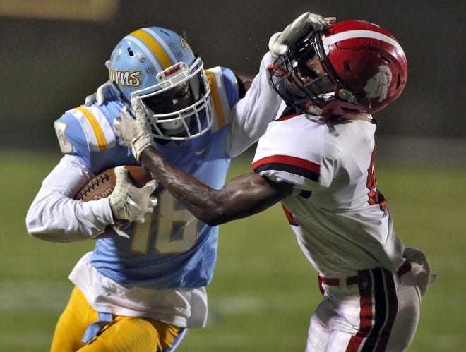 Burns' Kasen Twitty stiff arms a South Point tackler during last week's game. [Brittany Randolph/The Star]