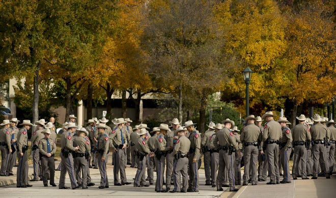 New Texas state troopers gather for a photo shoot at the state Capitol on Wednesday, Nov. 28, 2018, in preparation for their graduation ceremony. DPS graduated 92 new troopers who completed the department's 26-week recruit school. Future new hires could be subjected to waistline limits. [JAY JANNER/AUSTIN AMERICAN-STATESMAN]
