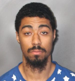 Samael Mathieu in a September 2018 booking photo. Mathieu, then 22 and living in Brockton, was charged with illegally carrying a firearm, illegally possessing ammunition and a large-capacity feeding device, possession of a firearm without a firearms identification card and illegal possession of a Class E substance. (Brockton police photo)