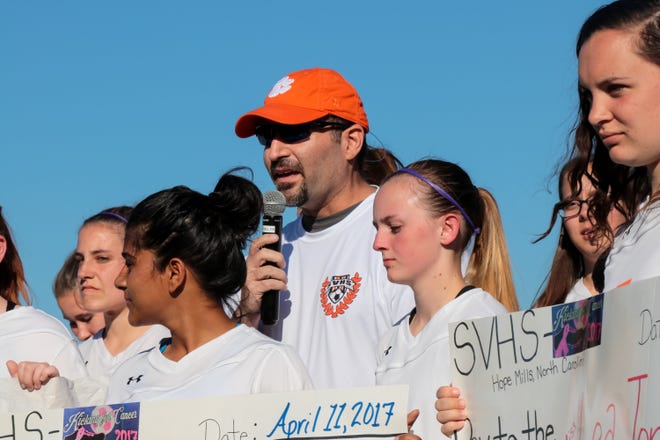 Davin Schmidt addresses the crowd as South View High School soccer team holds a ceremony to present donations raised by Kicking for Cancer for families affected by cancer on Tuesday, April 11, 2017. [Raul F. Rubiera/The Fayetteville Observer File Photo]