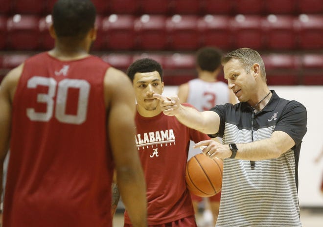 The University of Alabama unveiled its new menþÄôs basketball team and coaching staff with a short practice open to the media Wednesday. Head coach Nate Oats gives instructions to guard Jahvon Quinerly. [Staff Photo/Gary Cosby Jr.]