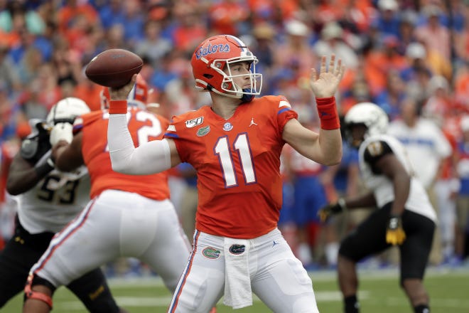 Florida quarterback Kyle Trask (11) throws a pass against Towson last week in Gainesville. [AP Photo/John Raoux]