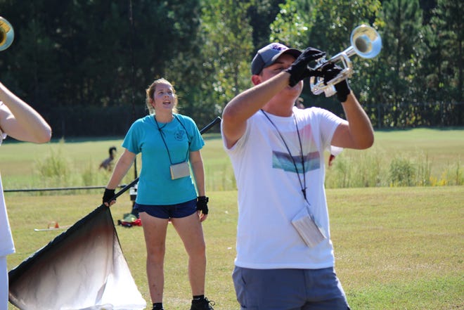 Trumpeter Brice Smith rehearses with the rest of the North Gaston Wildcat Band to prepare for their upcoming competition at Forestview. [Gavin Stewart/The Gaston Gazette]