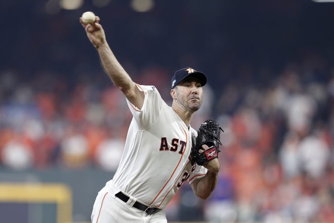 Houston Astros starting pitcher Justin Verlander (35) delivers a pitch against the Tampa Bay Rays in the first inning during Game 1 of a best-of-five American League Division Series baseball game in Houston, Friday. [MICHAEL WYKE/AP PHOTO]