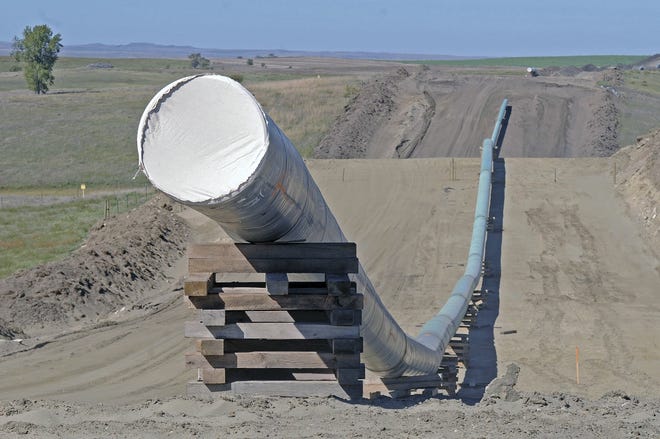 This photo shows a section of the Dakota Access Pipeline under construction in 2016. The pipeline drew high-profile protests at the time that have since sparked some states to outlaw such demonstrations. [Tom Stromme/The Bismarck Tribune]