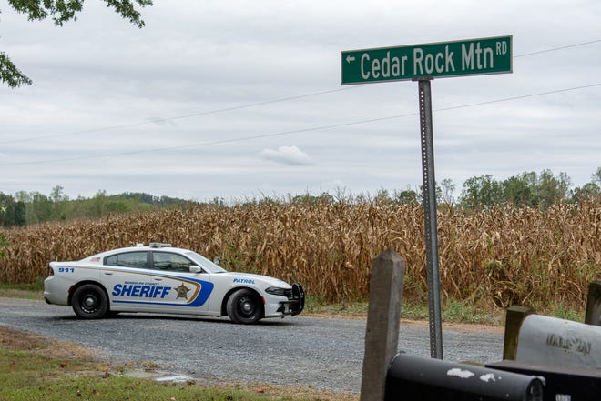 A Randolph County Sheriff's Office Patrol car blocks the road to secure the scene of the aircraft crash. [SCOTT PELKEY / THE COURIER-TRIBUNE]