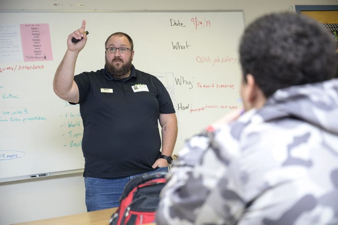 Guest speaker Rob Robison, from RoMac Lumber, teaches Eustis High School Construction Academy students about safety. [Cindy Sharp/Correspondent]