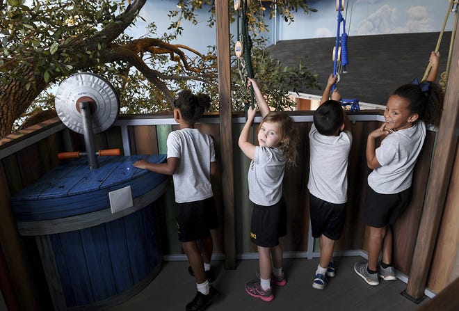 Children from St. Martha's School in Sarasota enjoyed a preview experience of the Bishop Museum's new Mosaic Backyard Universe. The new section officially opened Oct. 1. [TIFFANY TOMPKINS/THE BRADENTON HERALD]