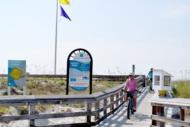 People bike across the Dune Allen/Fort Panic Regional Beach Access in South Walton County. The access is one of nine that will soon get upgrades. [NATHAN COBB/GATEHOUSE MEDIA FLORIDA]