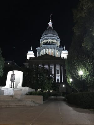 The Illinois State Capitol dome was illuminated Tuesday evening for the first time since 2015. [Brenden Moore/The State Journal-Register]
