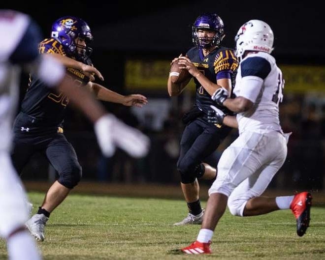 Jack Britt quarter Kevin Sentell, shown playing against Terry Sanford earlier in the season, passed for six touchdowns and completed 12 of 13 passes in the Buccaneers' 48-7 win at Lumbeton on Friday. [Andrew Craft/The Fayetteville Observer file]