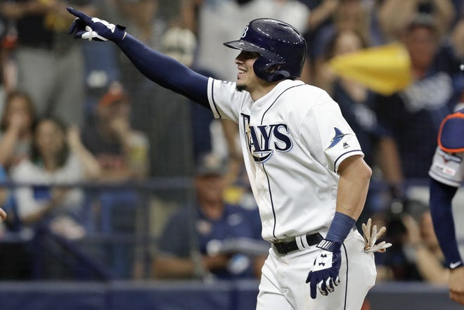 Tampa Bay Rays' Willy Adames celebrates his sixth-inning solo home run against the Houston Astros during Game 3 of an American League Division Series on Monday in St. Petersburg. [AP Photo/Chris O'Meara]