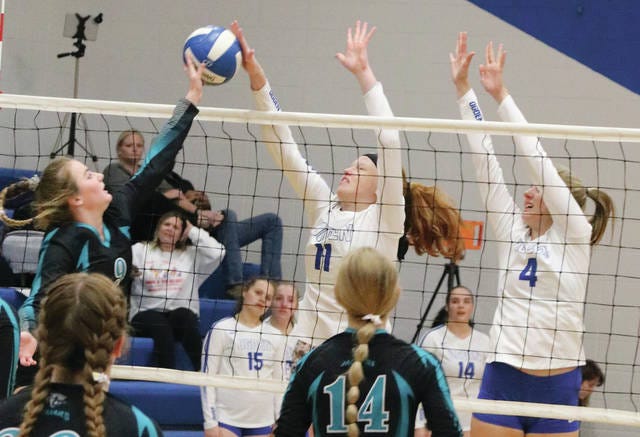 MaKayla Claude and Margo Christensen go up to block a shot for the Ogden volleyball team. The Bulldogs entered this week with a 10-12 record. Photo by Andrew Logue/News-Republican