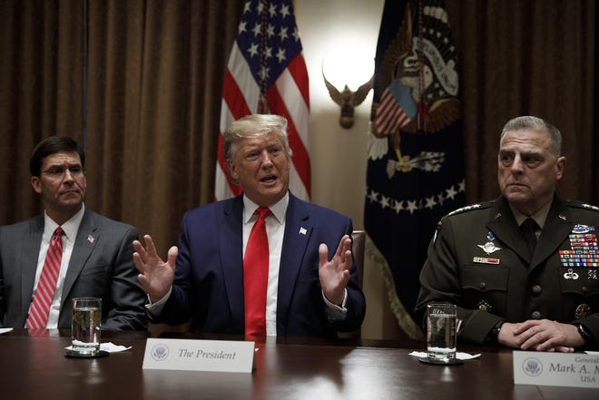 President Donald Trump, joined by from left, Defense Secretary Mark Esper, and Chairman of the Joint Chiefs of Staff Gen. Mark Milley, speaks to media during a briefing with senior military leaders in the Cabinet Room at the White House in Washington Monday. [AP Photo/Carolyn Kaster]
