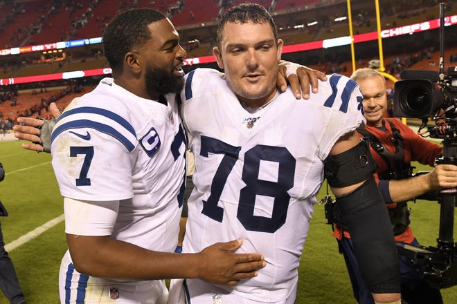 Indianapolis Colts quarterback Jacoby Brissett (7) and center Ryan Kelly, a former Alabama player, celebrate following an NFL football game against the Kansas City Chiefs in Kansas City, Missouri, on Sunday. The Colts won 19-13. [Associated Press]
