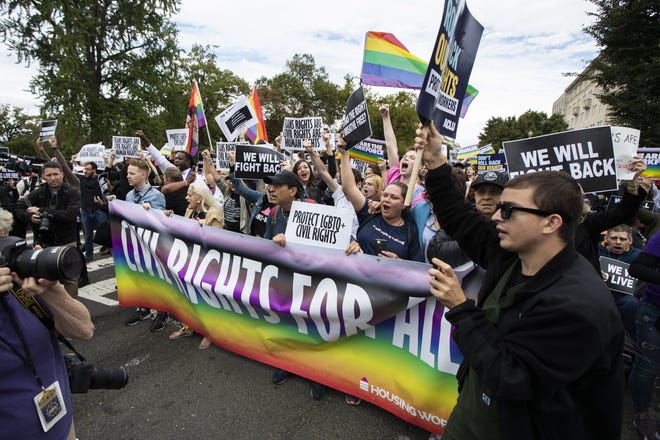 Supporters of LGBTQ rights stage a protest on the street in front of the U.S. Supreme Court in Washington on Tuesday. The Supreme Court heard arguments in its first cases on the issue since the retirement of Justice Anthony Kennedy. [Manuel Balce Ceneta/The Associated Press]