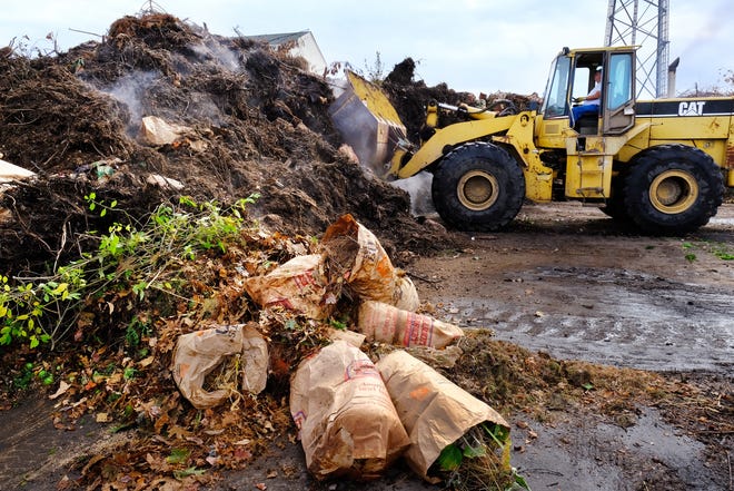 A front end loader removes leaves and yard waste from the Portsmouth Recycling Center. The Department of Public Works reminds residents that dumping fall leaves in or near water bodies and wetlands is against the law.
[Rich Beauchesne/Seacoastonline]