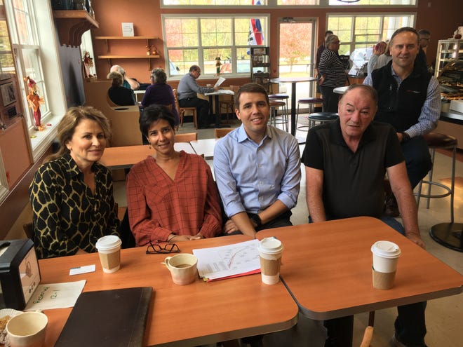 Local residents joined Rep. Pappas for discussion on lowering drug costs at Potter's House Bakery and Cafe in Rochester Wednesday. [Courtesy]