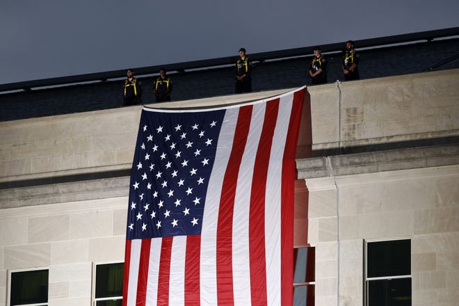 A Vox caller wants to see the American flag on more prominent display during political debates. (AP Photo/Patrick Semansky)