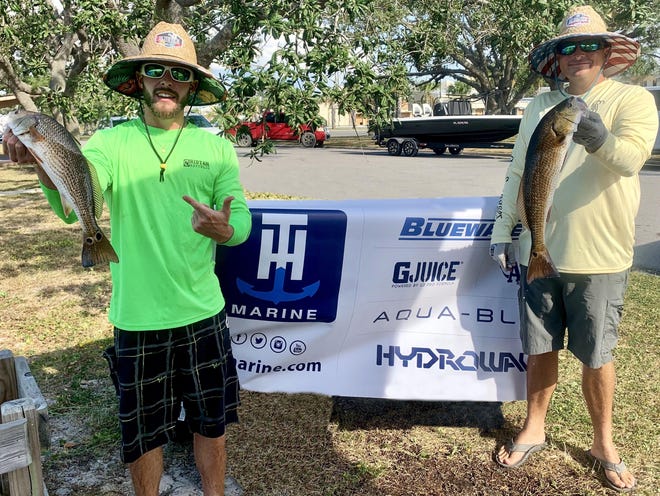 Jake and AJ show their catches after weigh-in at the finale of the Emerald Coast Redfish Championship. [CONTRIBUTED PHOTO]