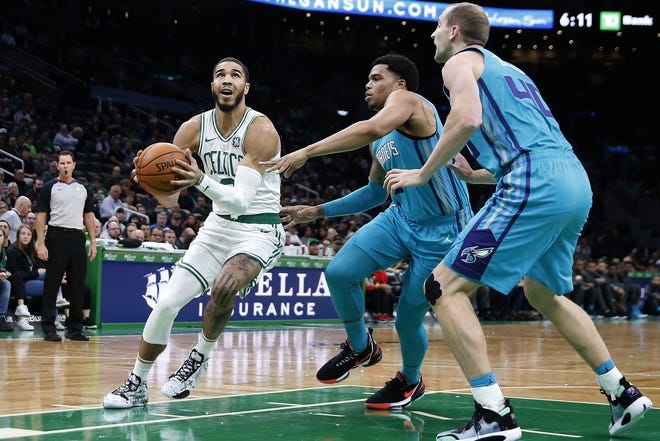 The Celtics' Jayson Tatum scored a team-best 20 points on 8 for 14 shooting in last Sunday's preseason opener against the Charlotte Hornets. [AP / Michael Dwyer]