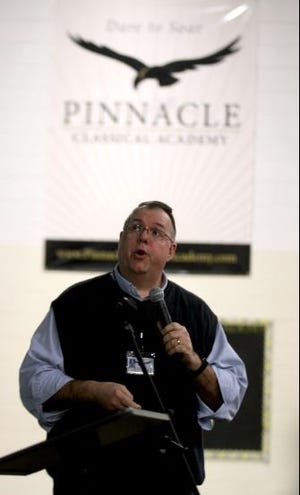 Robert Brown speaks at the annual lottery to determine who will be admitted to Pinnacle Classical Academy. [Brittany Randolph / The Star]