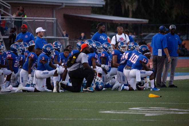 Savannah State coaches talk with Tiger players during the 2019 spring game. [SSU ATHLETICS]