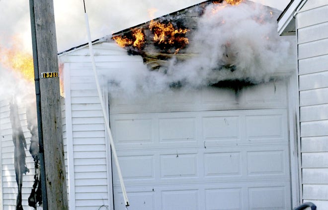 A garage in the 300 block of Arden Park Avenue in Sturgis was damaged by fire Wednesday. The incident is being investigated for suspected arson. [Brandon Watson/Journal]