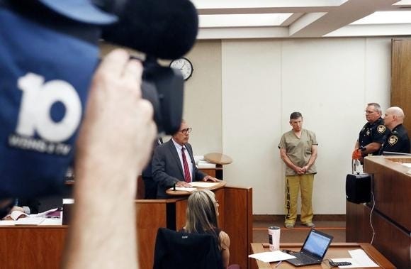 A WBNS cameraman tapes video of Terry Sherman defense attorney for Mike Davis WBNS meteorologist being arraigned in Frankin County Municipal Court Sept. 6 on a charge the 60-year-old sent and received pornographic images involving minors. (GateHouse Media Ohio / Eric Albrecht, The Columbus Dispatch)