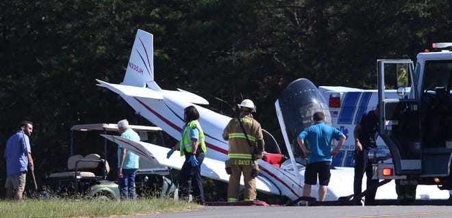 Fire and rescue on the scene of a plane crash Friday afternoon at Gastonia Municipal Airport on Gaston Day School Road. [Mike Hensdill/The Gaston Gazette]