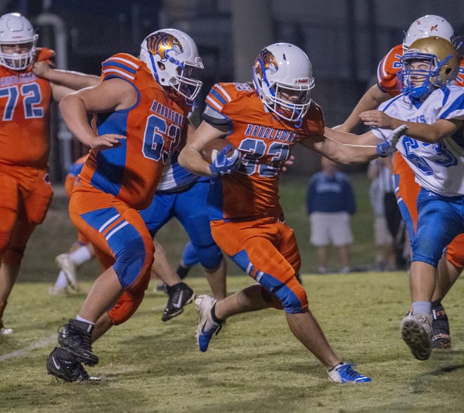 RHS' Tradd White digs for yardage, on his way to a TD Friday night. [PAUL CHURCH/ THE COURIER-TRIBUNE]