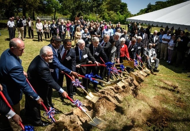 Local and state officials break ground on the $65 million N.C. Civil War & Reconstruction History Center in this file photo from April of 2018. Fayetteville Mayor Mitch Colvin, fourth from left, has since said he would like to see a change in the center's name and concept for him to continue to support the project. [Andrew Craft/The Fayetteville Observer]