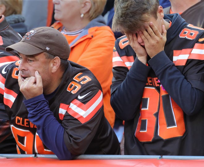 Browns fans look dejected during the fourth quarter Sunday against the Seattle Seahawks in Cleveland. [Phil Masturzo/Beacon Journal/Ohio.com]