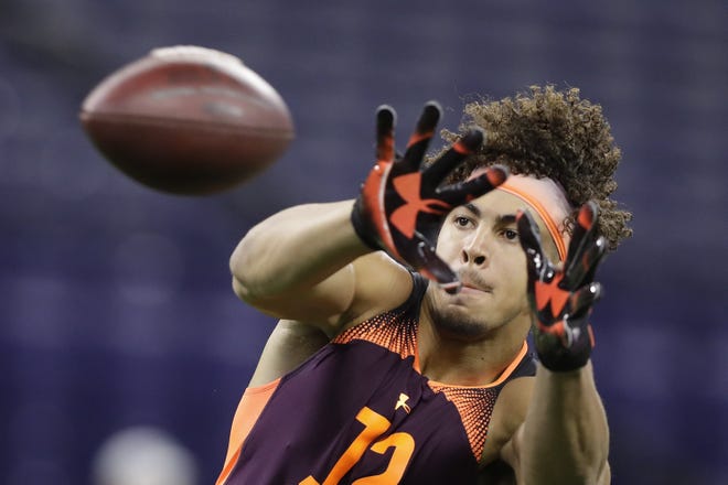 Tight end Josh Oliver runs a drill during the NFL combine in March in Indianapolis. [AP Photo/Darron Cummings]