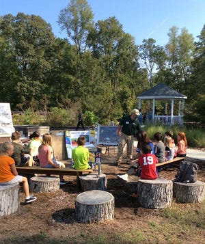 Master Gardener volunteers assist with the Growing Minds Program at Onslow County Cooperative Extension inside the Discovery Garden. Richlands Elementary School third graders learned about pollinators, snakes, dairy farms, water quality and more. [Contributed photo]