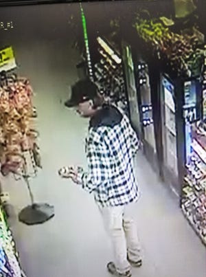 The Holly Ridge Police Department is searching for the subject in an armed robbery at the Dollar General Monday afternoon. This photo is a still taken from the surveillance video in the store. [Contributed photo]