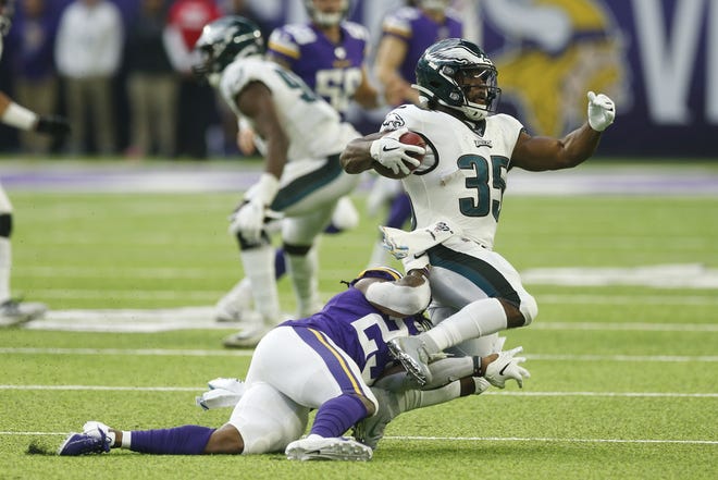 Philadelphia Eagles' Orlando Scandrick is tackled by Minnesota Vikings' Mike Boone, left, during the second half of an NFL game on Sunday in Minneapolis. The Eagles lost to fall to 3-3 this season. [AP PHOTO/JIM MONE]